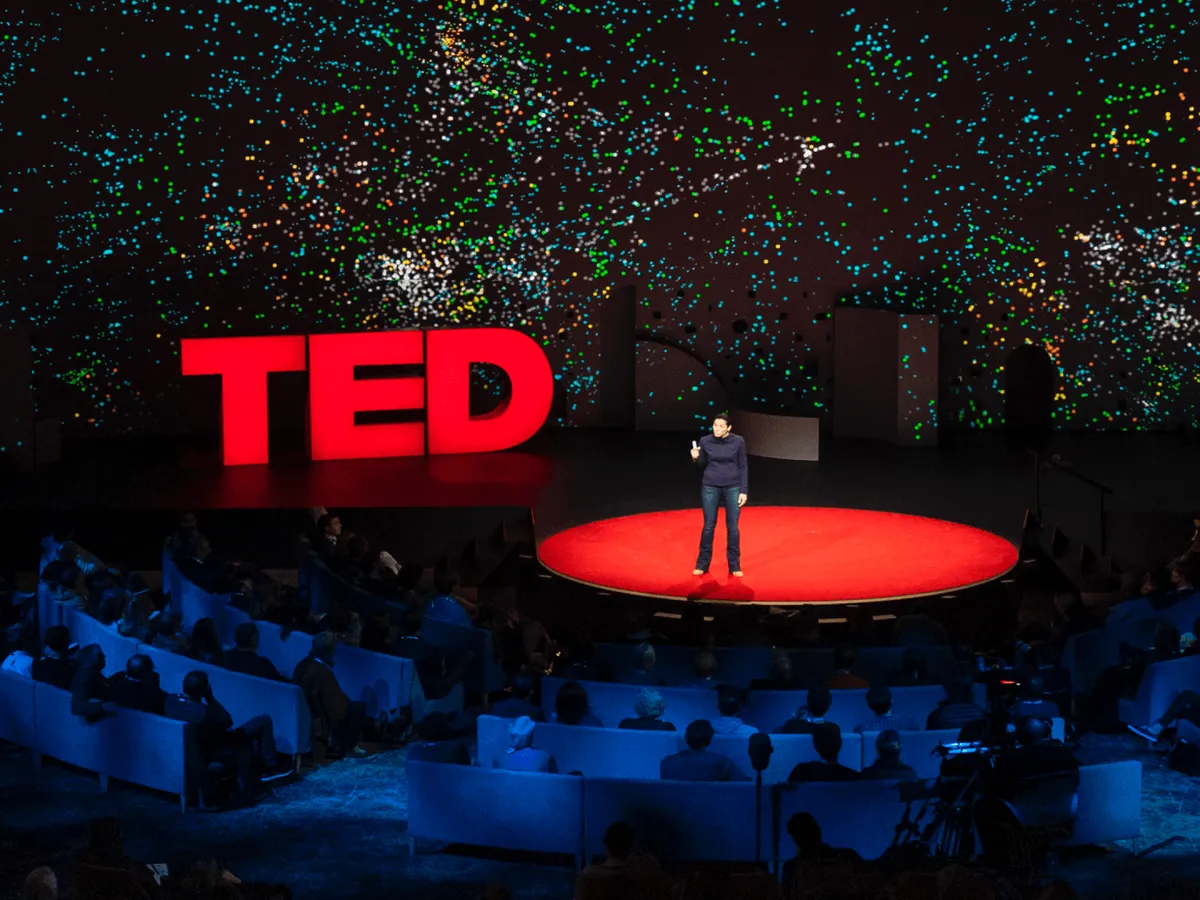 TED conference stage with speaker